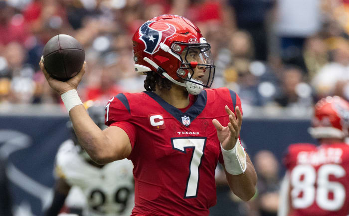 Houston Texans quarterback C.J. Stroud models the team's Battle Red jerseys and helmets.